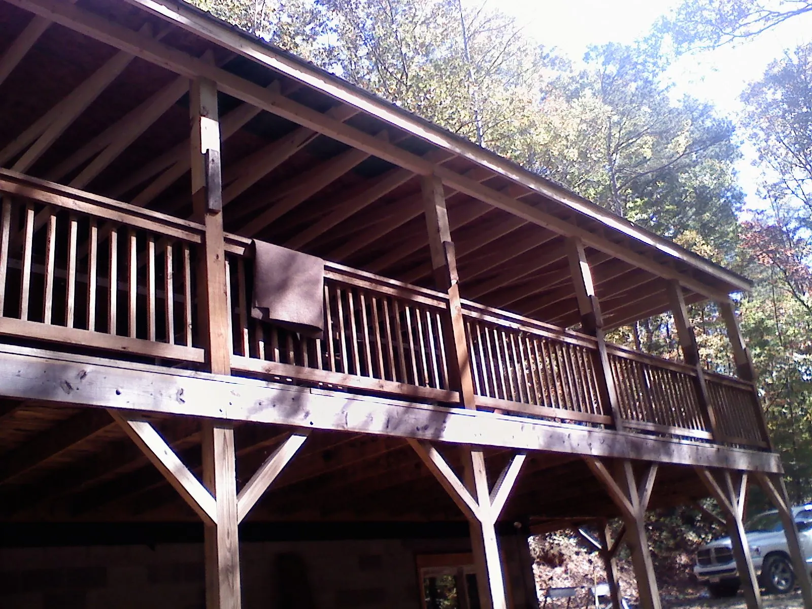 Timber framing under a new elevated porch and deck — Roof Leak Repair in Morganville by Roofing Brothers